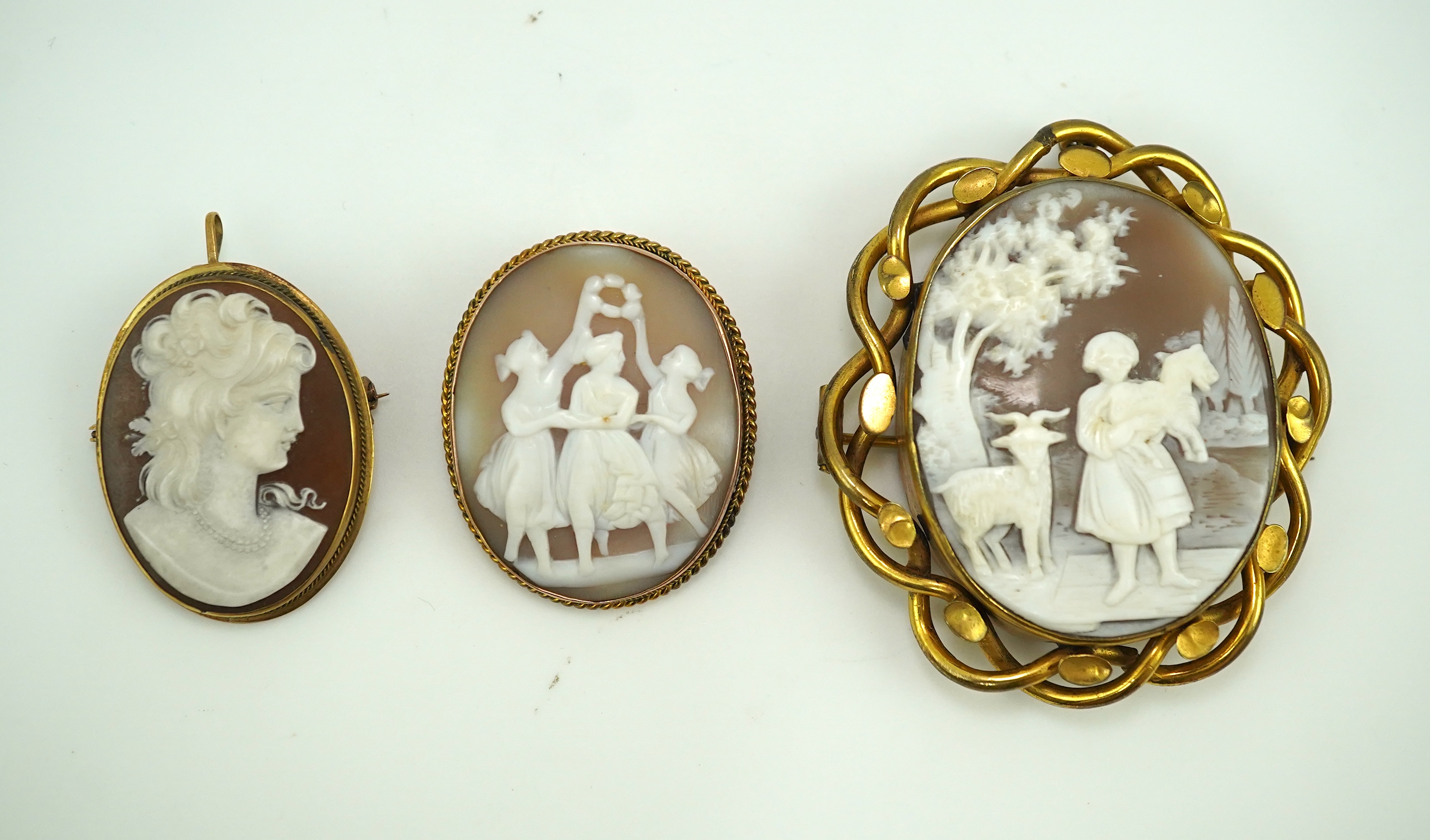 Three shell cameo brooches, 20th century